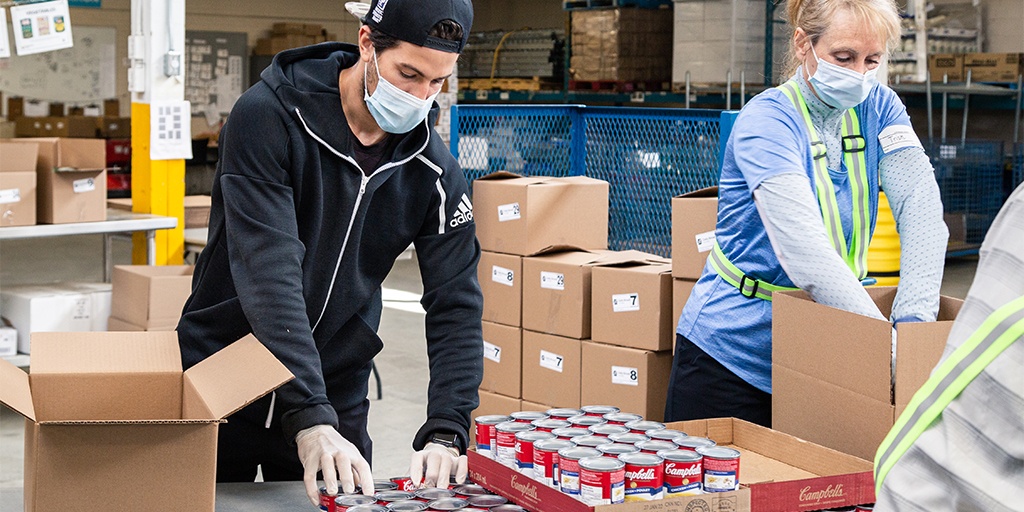 Food is sorted and packed at the Daily Bread Food Bank in Toronto